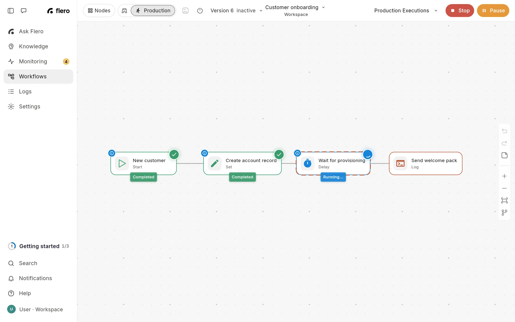 The editor during a live run: the red Stop and orange Pause buttons replace Run Workflow, two nodes are marked Completed and the Delay node shows Running.